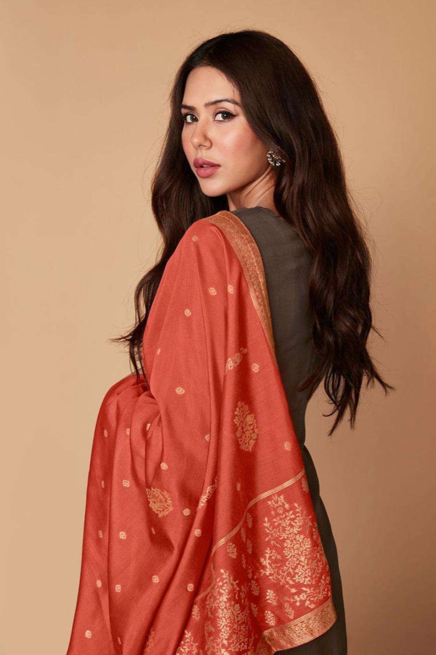 Pair soft grey tones with metallic accents for a modern twist on ethnic wear.