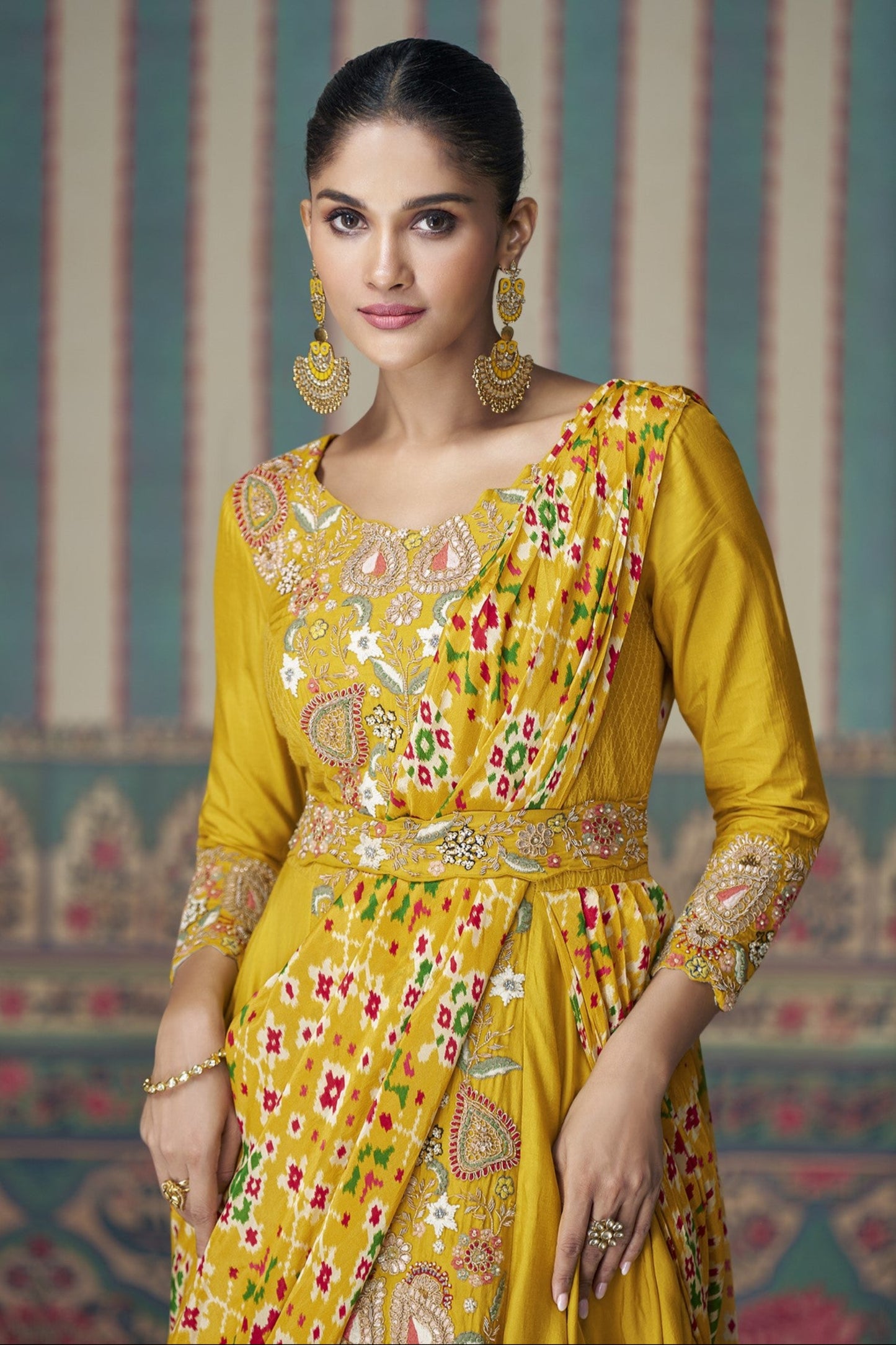 Yellow Anarkali gown in Chinon silk with embroidery work, bringing a bright and graceful charm to festive celebrations.