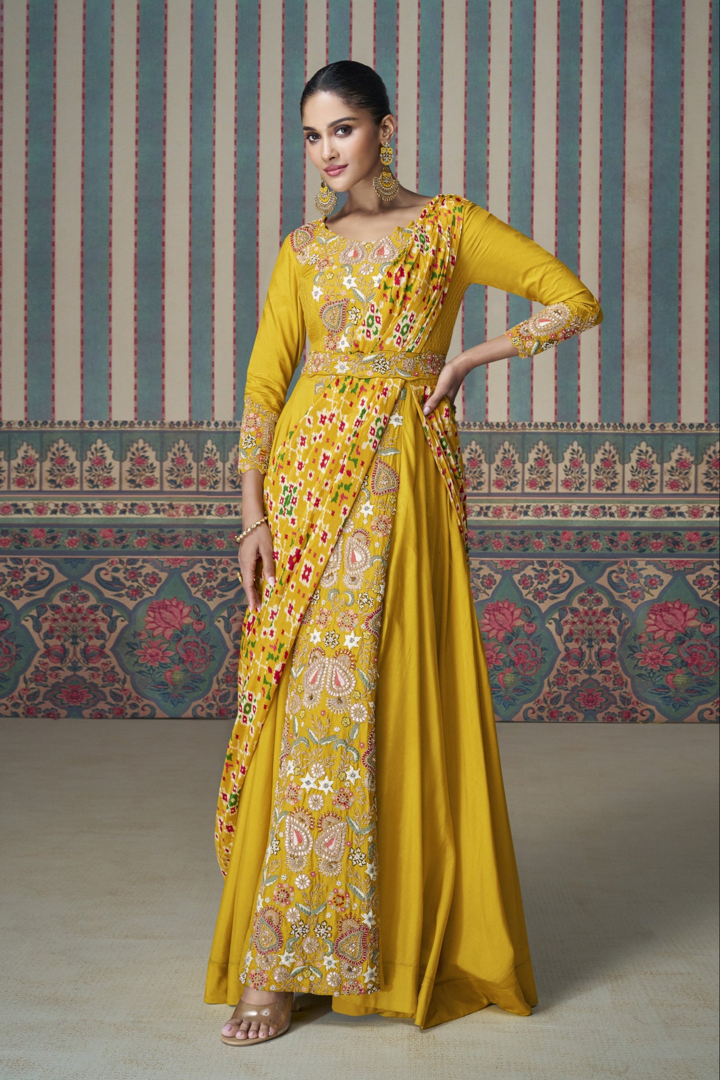 Yellow Anarkali gown in Chinon silk with embroidery work, bringing a bright and graceful charm to festive celebrations.