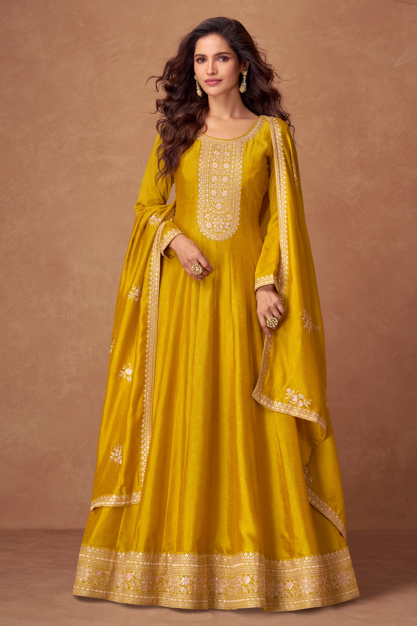 Yellow color Anarkali gown radiates warmth and charm, ideal for Haldi functions, daytime events, and festive occasions.
