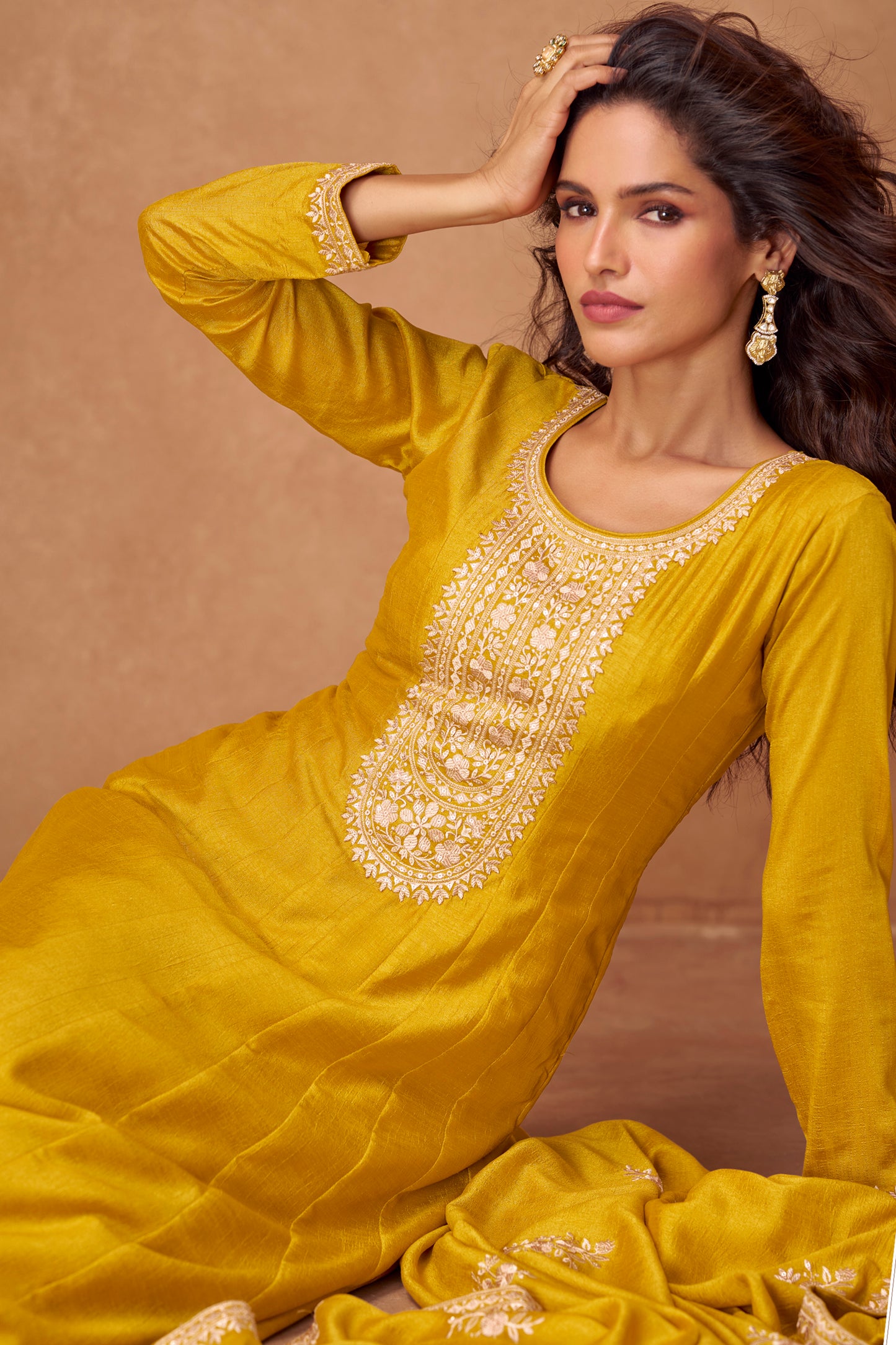 Yellow color Anarkali gown radiates warmth and charm, ideal for Haldi functions, daytime events, and festive occasions.