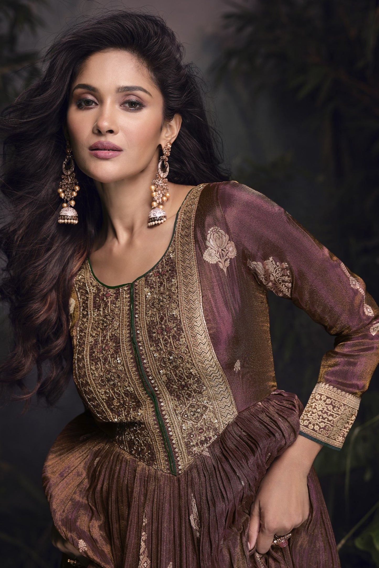 Dark brown Anarkali gown in viscose jacquard silk with embroidery work, paired with a net dupatta for an elegant festive ensemble.