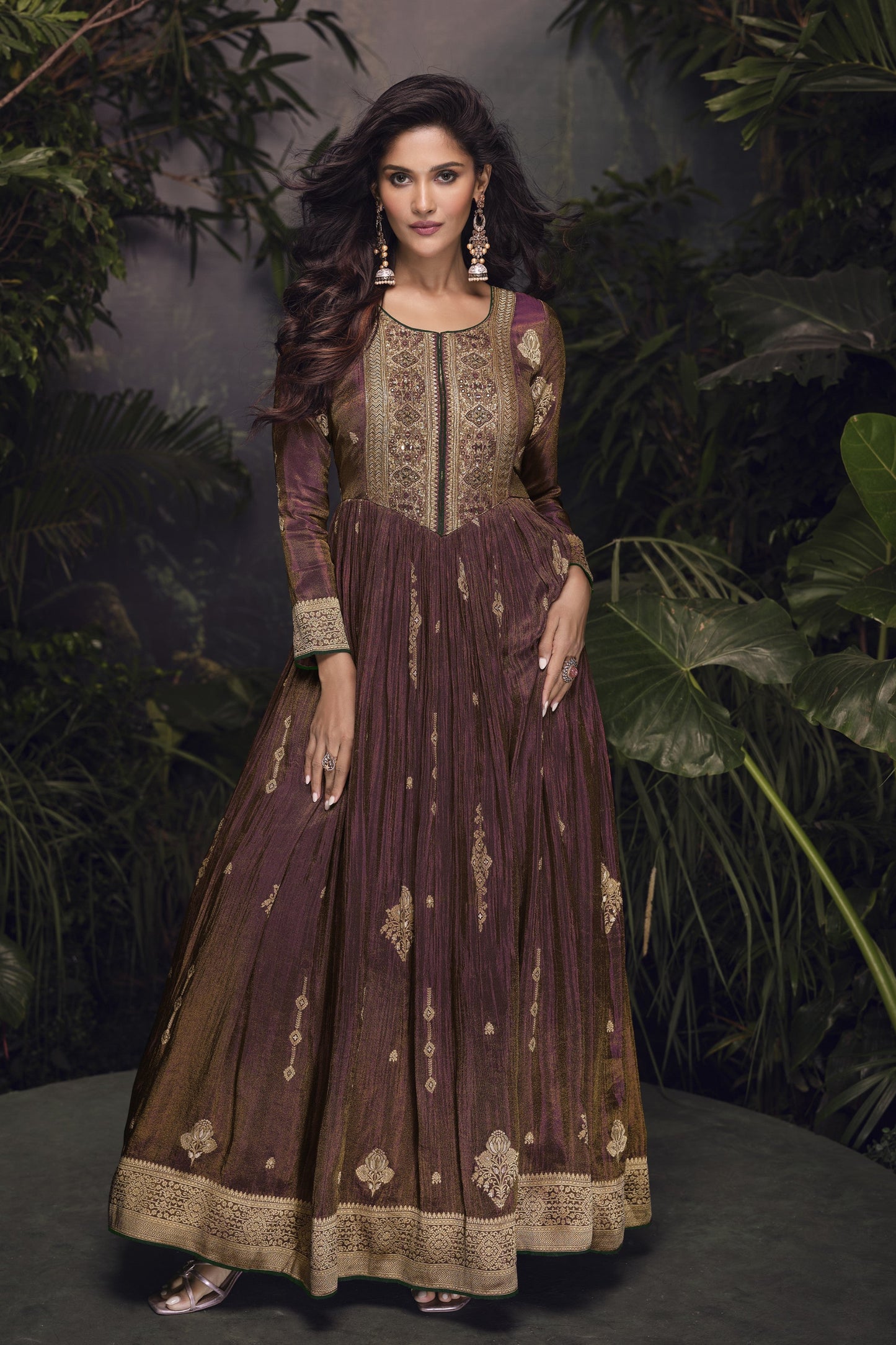 Dark brown Anarkali gown in viscose jacquard silk with embroidery work, paired with a net dupatta for an elegant festive ensemble.
