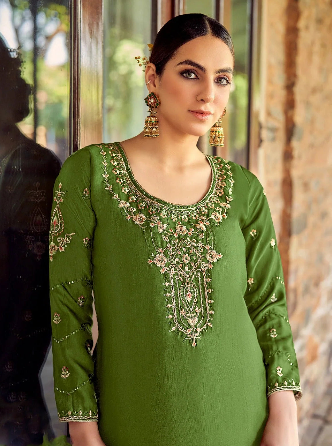 Green colour cotton wear symbolizes freshness and festivity – great for Mehndi or family gatherings.