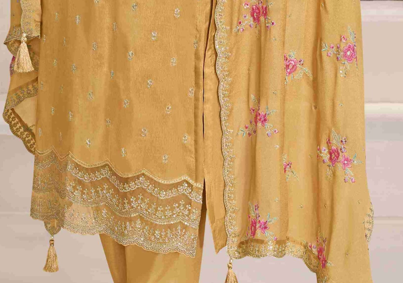 Yellow salwar kameez is bright and happy. Good for haldi or sunny events.