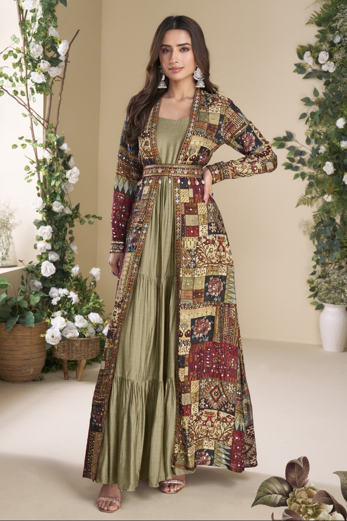 Sage green Indo-Western Anarkali gown in silk fabric with embellished work, offering a subtle yet stylish look for festive occasions.