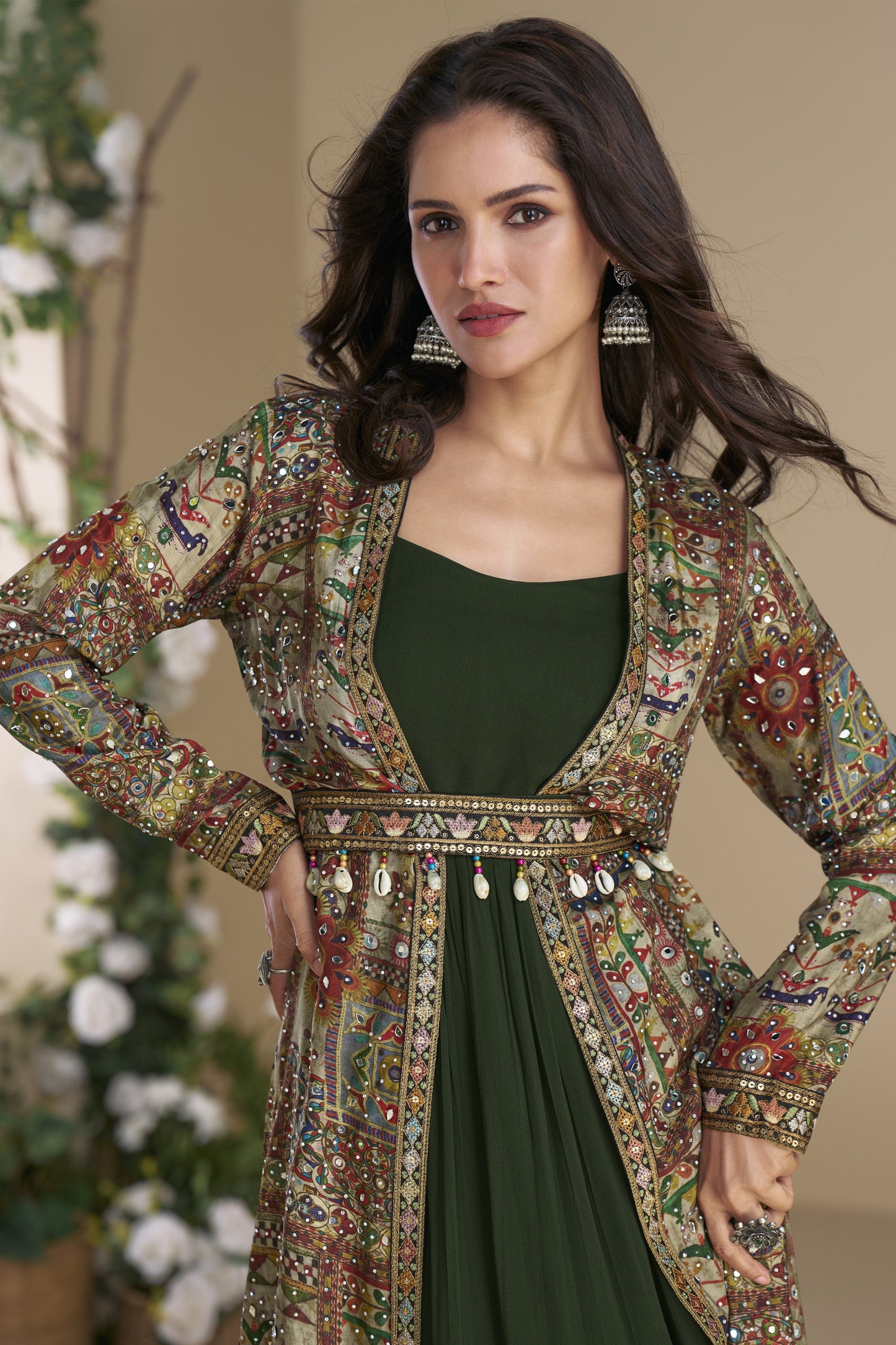 Dark green Indo-Western Anarkali gown in silk fabric with embellished work, showcasing a regal and graceful festive look.