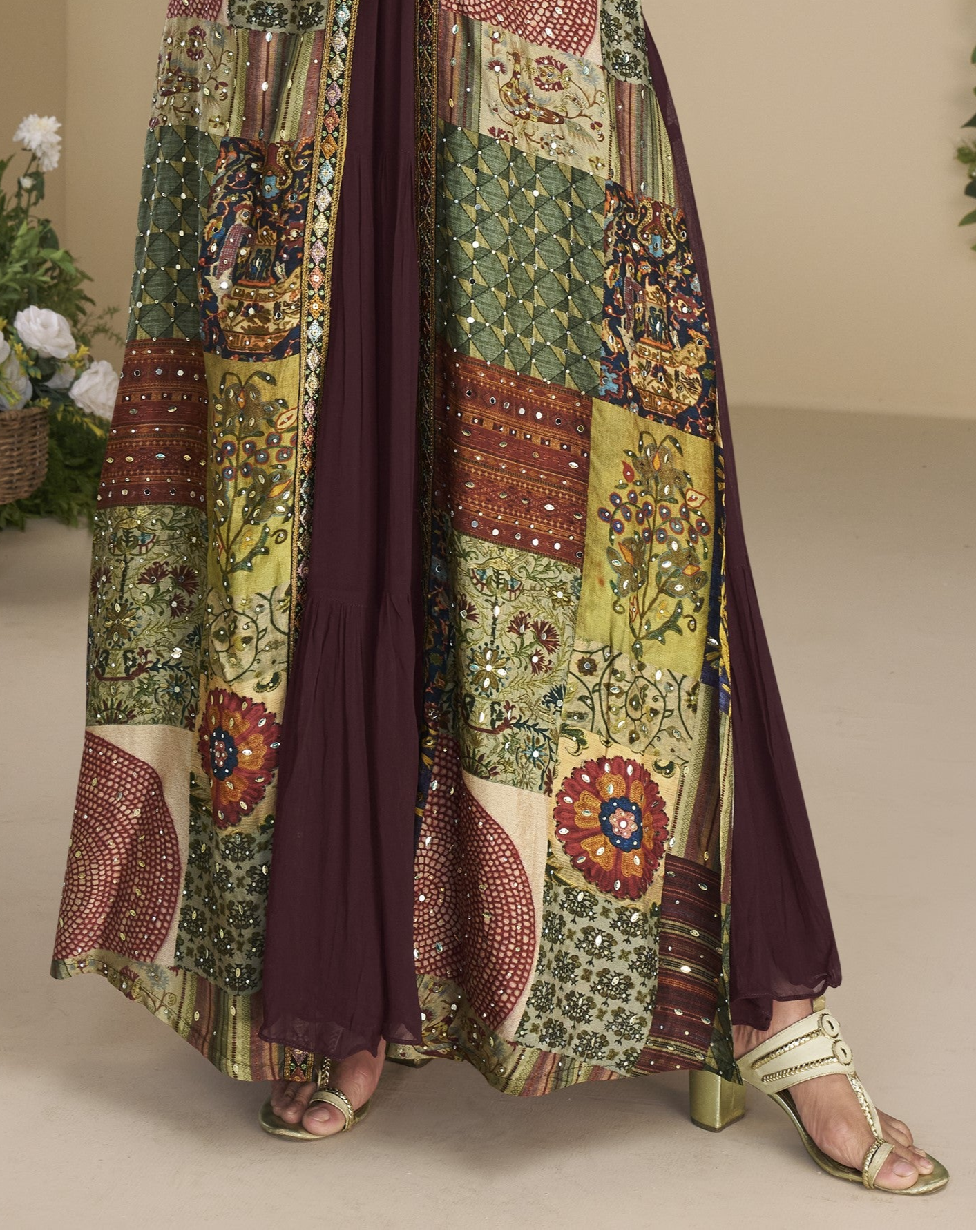Dark brown Indo-Western Anarkali gown in silk fabric with embellished work, perfect for festive elegance.