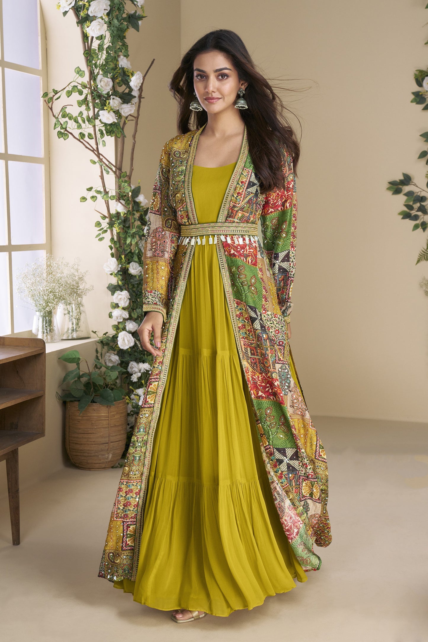 Dark yellow Indo-Western Anarkali gown in silk fabric with embellished work, combining vibrant charm with festive elegance.