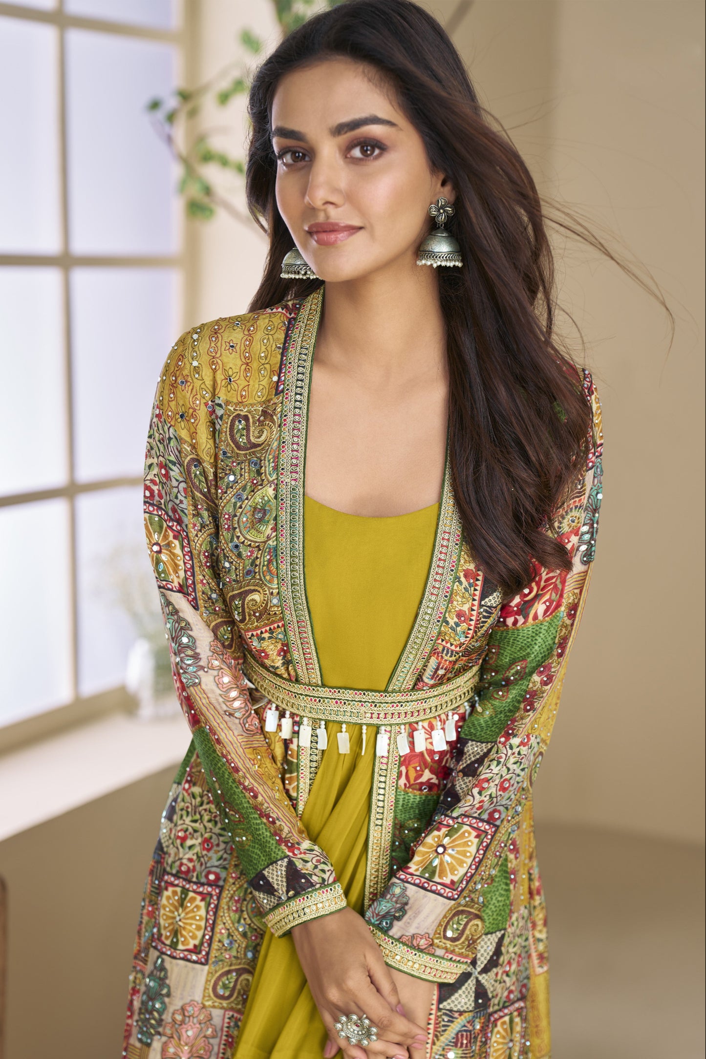 Dark yellow Indo-Western Anarkali gown in silk fabric with embellished work, combining vibrant charm with festive elegance.