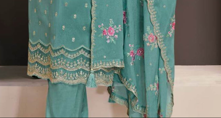 Teal salwar kameez is cool and refreshing. It blends blue and green for a unique look