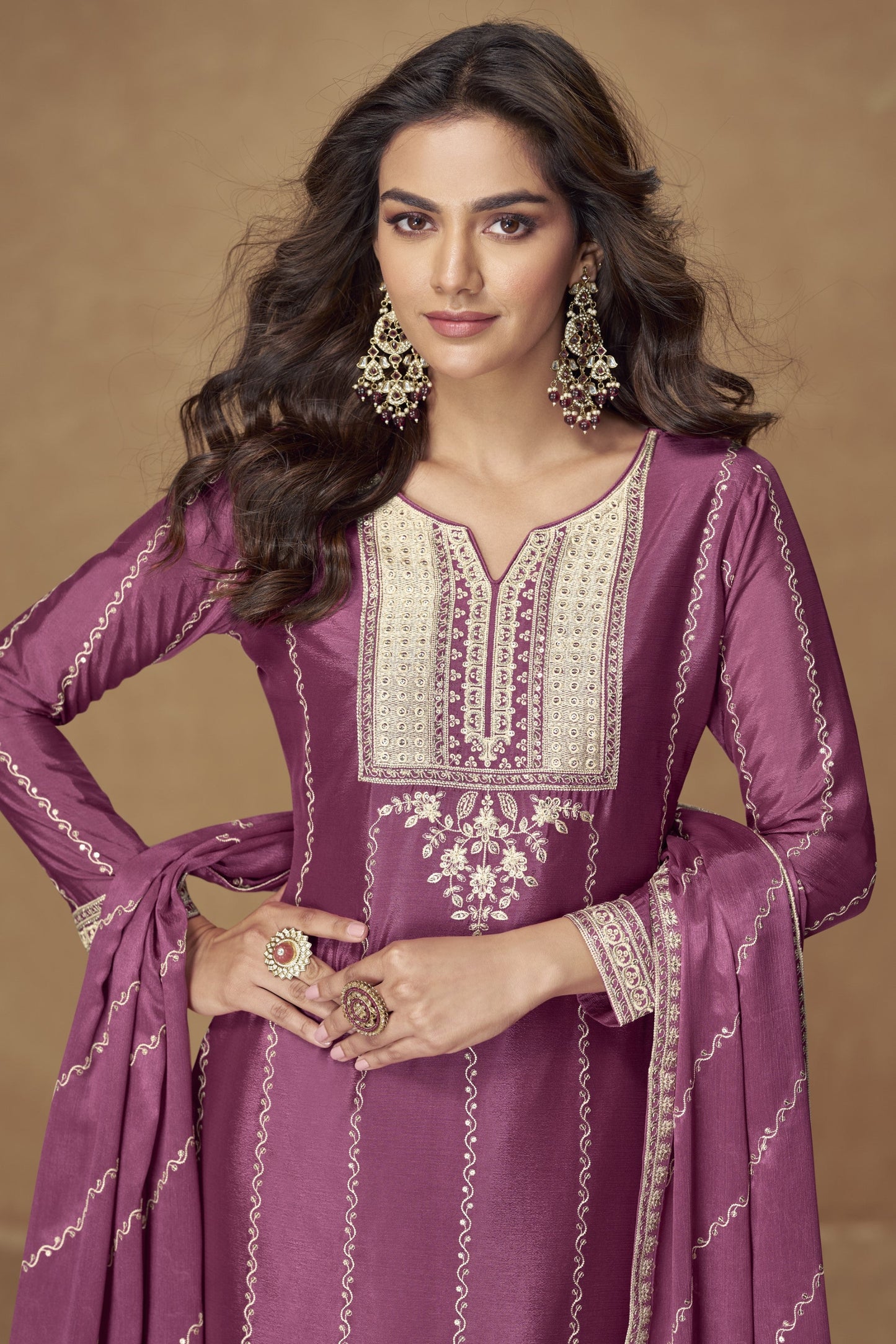 Dark pink color palazzo suit with embroidery work, offering a bold and vibrant look ideal for festive and special occasions.
