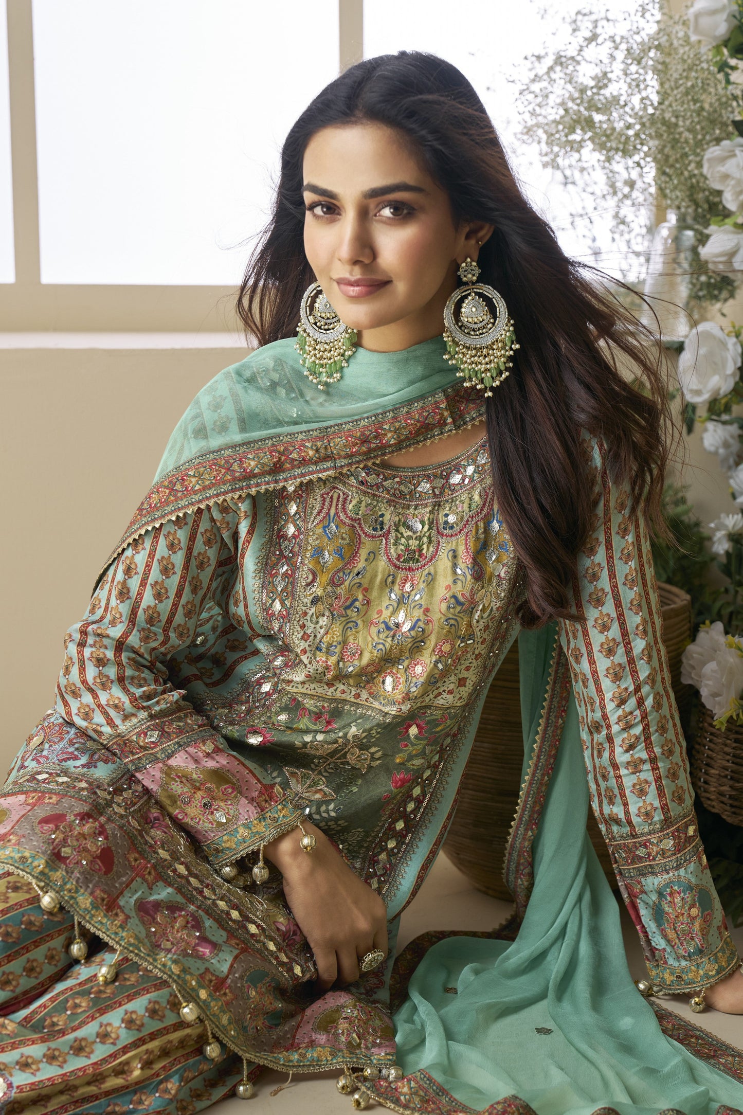 Palazzo suit in viscose fabric with hand zari and embellished work, offering a rich and elegant look ideal for festive and traditional occasions.