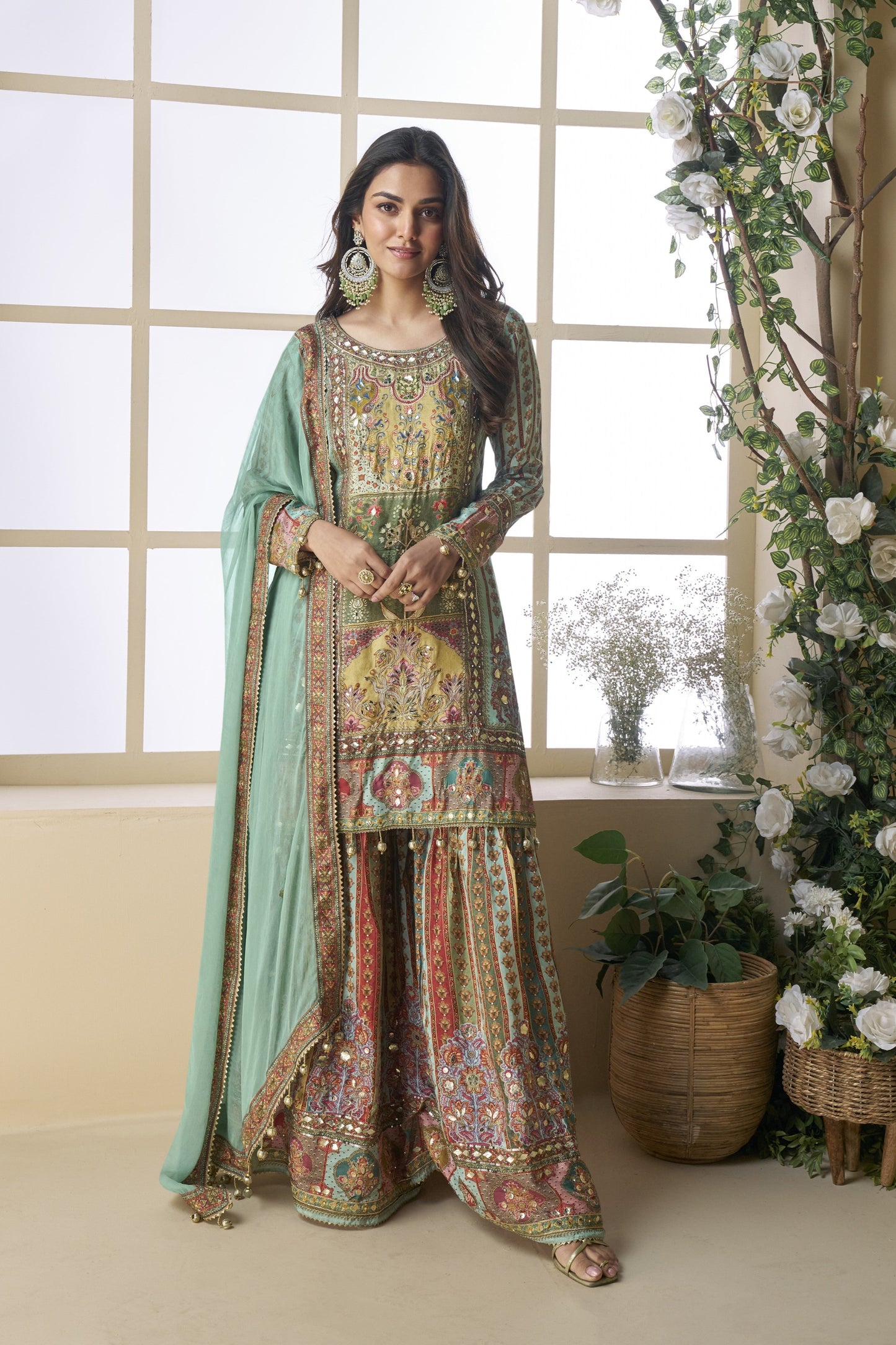 Palazzo suit in viscose fabric with hand zari and embellished work, offering a rich and elegant look ideal for festive and traditional occasions.