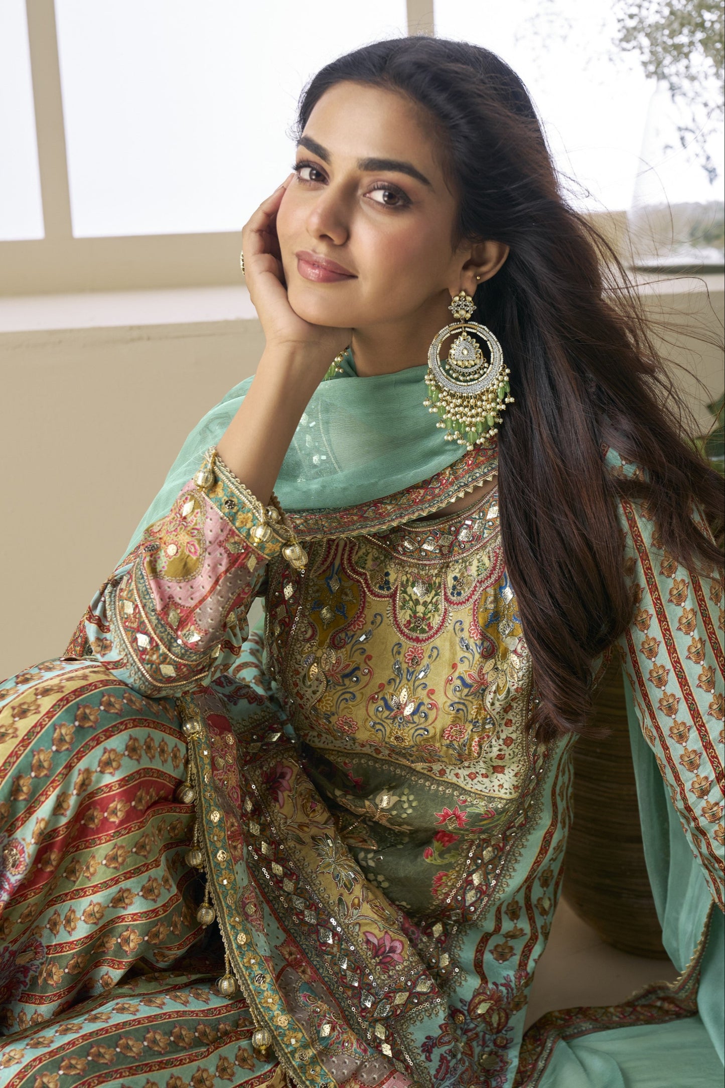 Palazzo suit in viscose fabric with hand zari and embellished work, offering a rich and elegant look ideal for festive and traditional occasions.