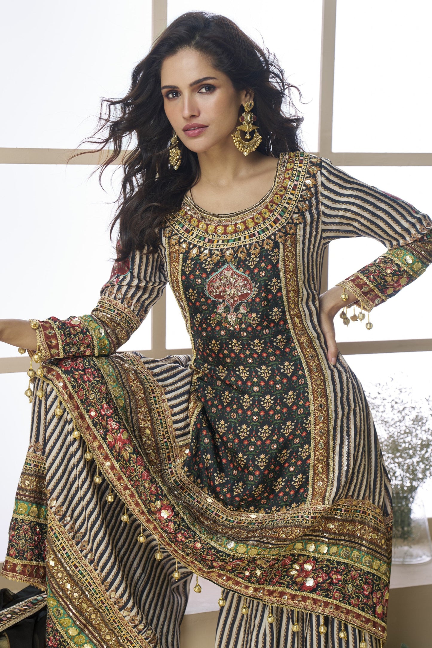 Black and grey color palazzo suit in viscose fabric with hand zari and embellished work, blending modern tones with traditional elegance for festive wear.