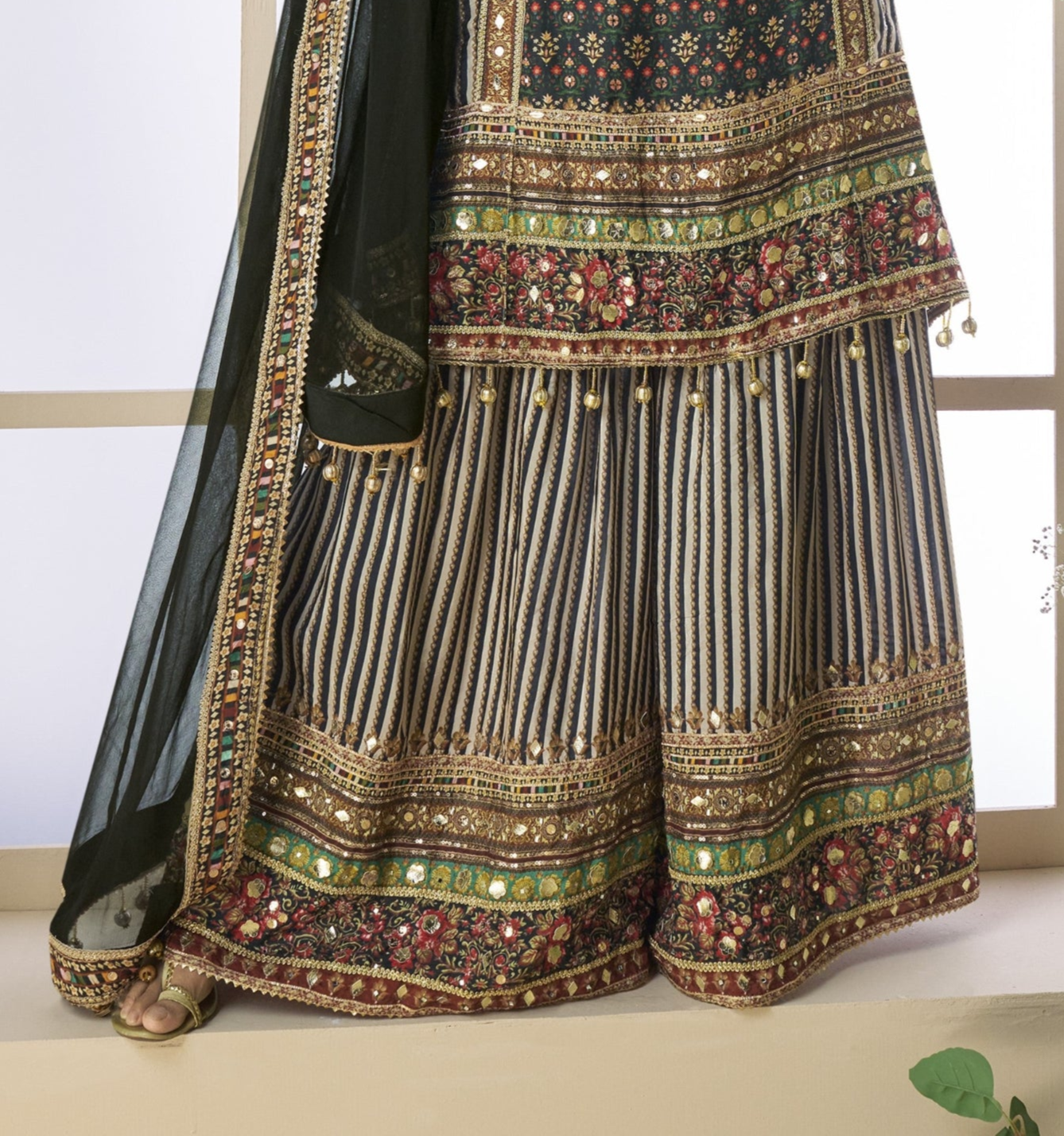 Black and grey color palazzo suit in viscose fabric with hand zari and embellished work, blending modern tones with traditional elegance for festive wear.