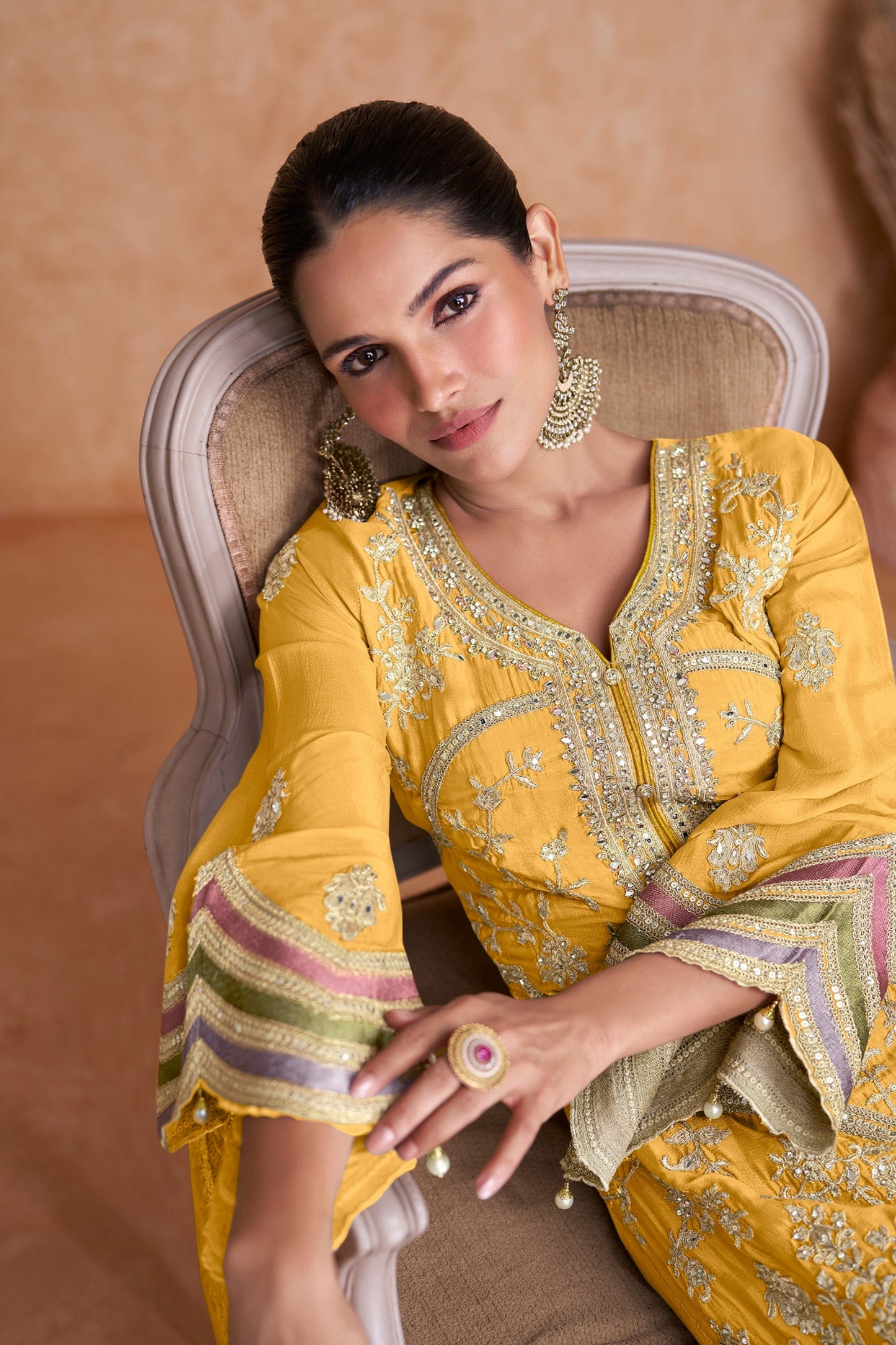 Yellow salwar kameez is bright and happy. Good for haldi or sunny events.
