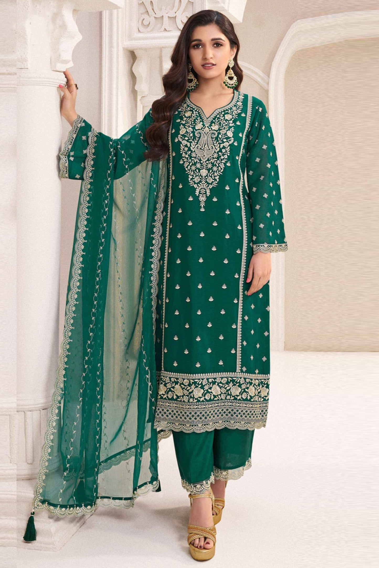 Teal salwar kameez is cool and refreshing. It blends blue and green for a unique look