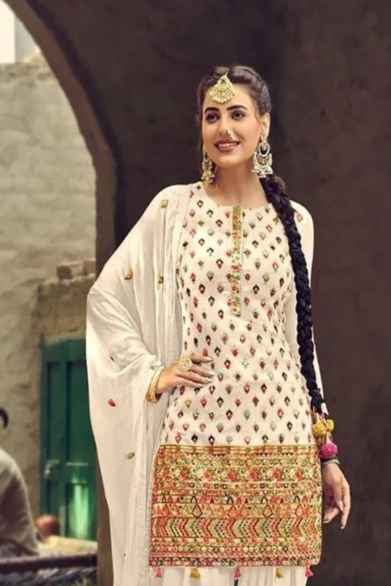 White salwar kameez is pure and classic. Ivory with embroidery looks soft and pretty.