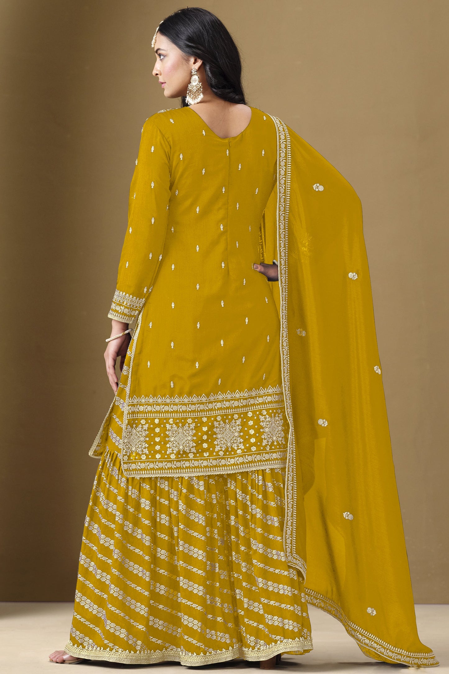 Yellow salwar kameez is bright and happy. Good for haldi or sunny events.