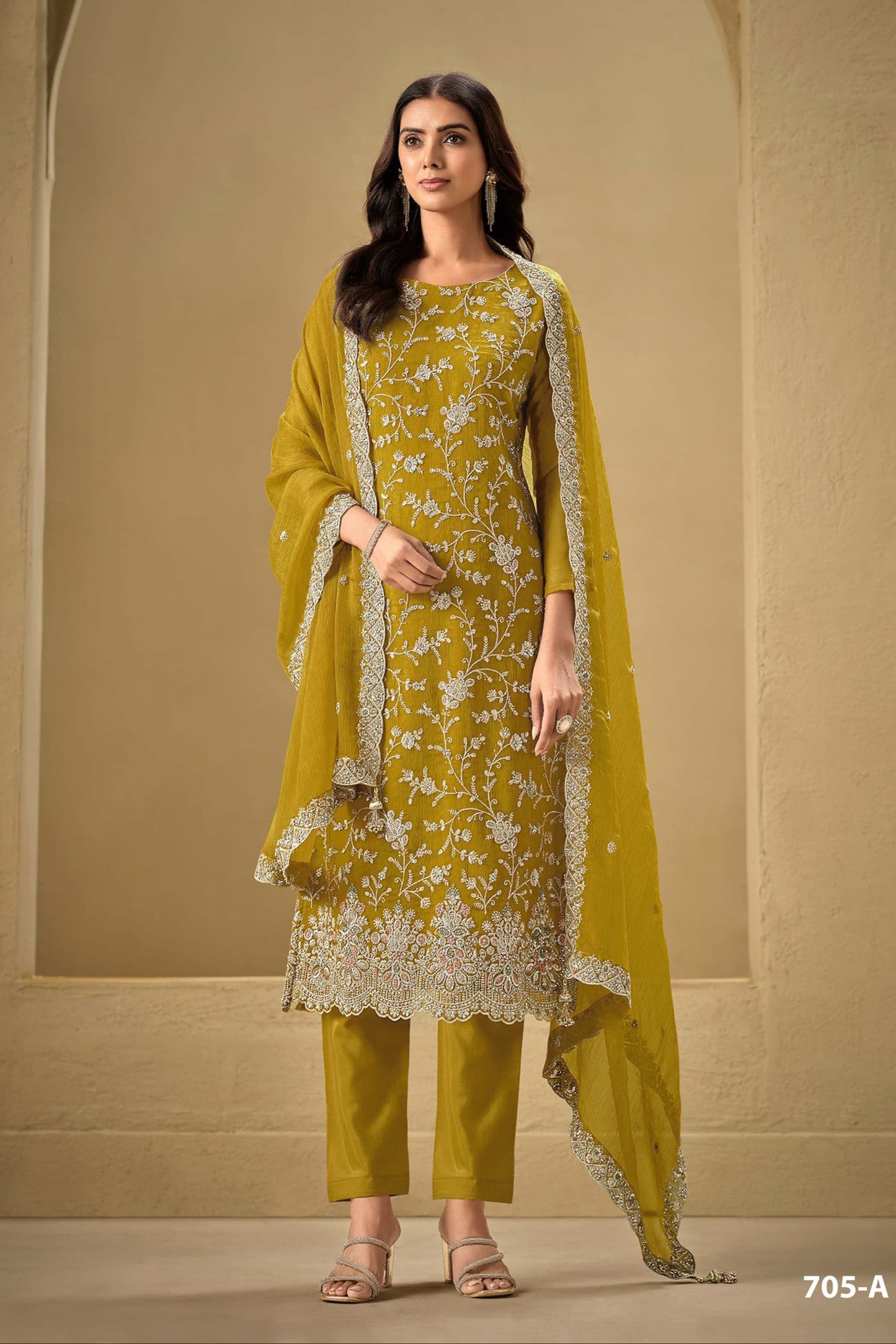 Gold salwar kameez looks royal and festive. Great for parties and celebrations.