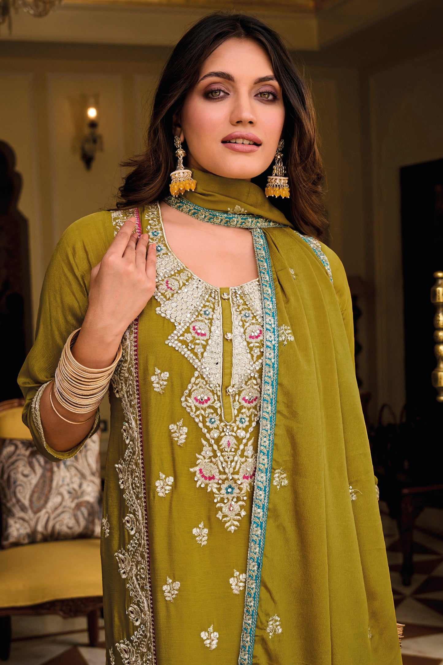 Yellow salwar kameez is bright and happy. Good for haldi or sunny events.