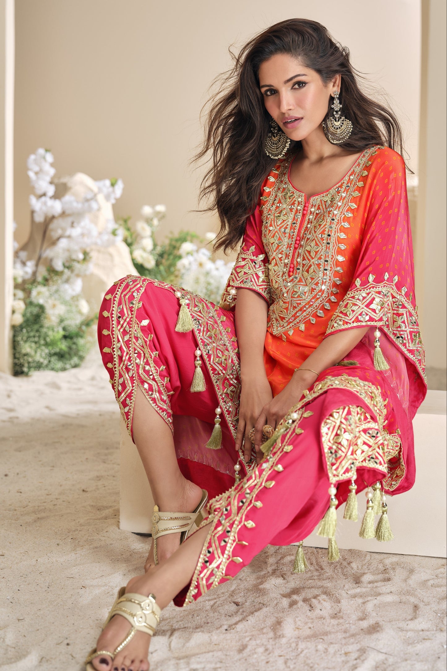 Orange color salwar kameez in viscose silk with embroidery, mirror work, and embellished detailing, adding vibrant elegance to your festive and celebration wardrobe.
