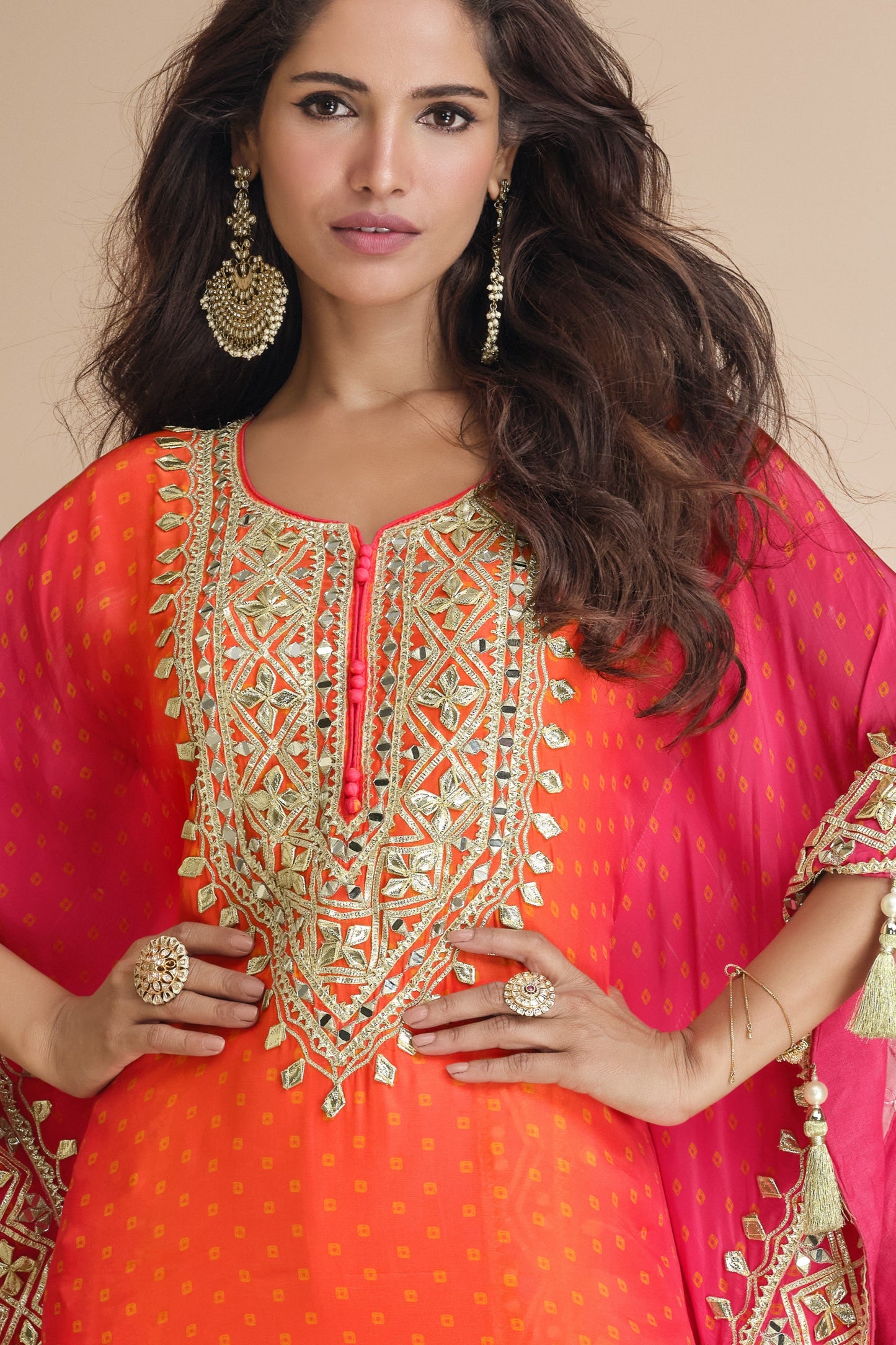 Orange color salwar kameez in viscose silk with embroidery, mirror work, and embellished detailing, adding vibrant elegance to your festive and celebration wardrobe.