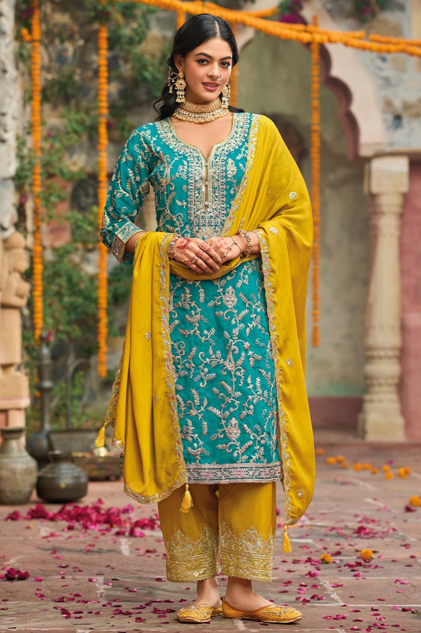 Teal salwar kameez is cool and refreshing. It blends blue and green for a unique look