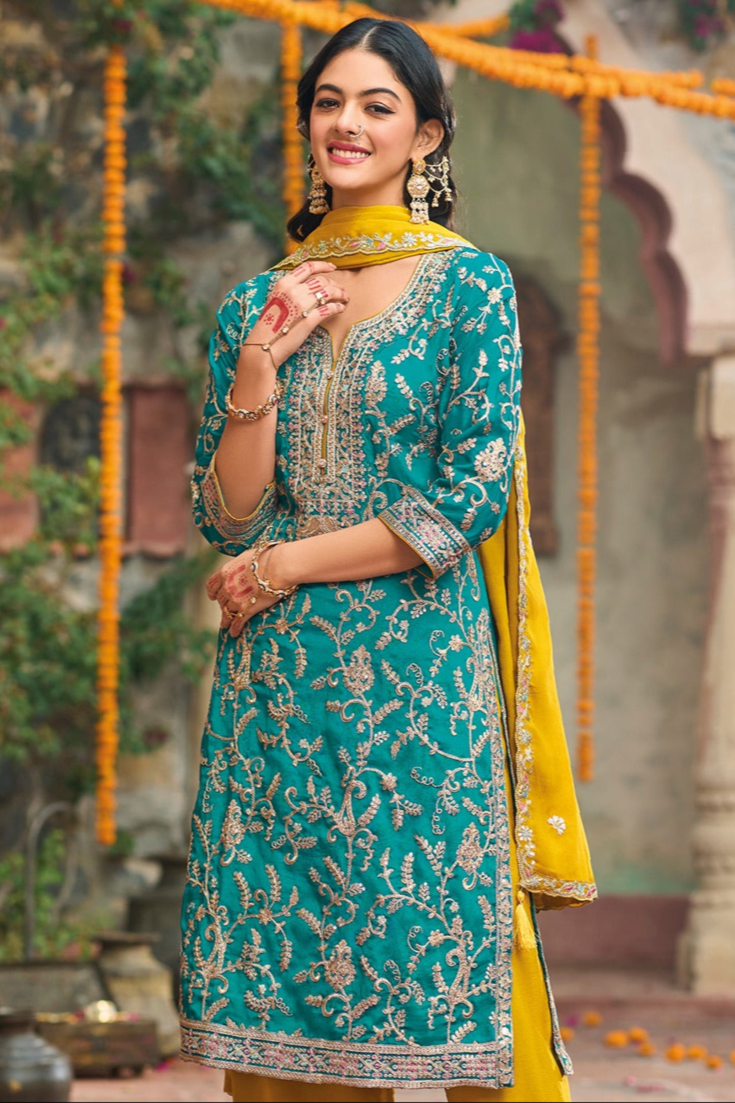 Teal salwar kameez is cool and refreshing. It blends blue and green for a unique look