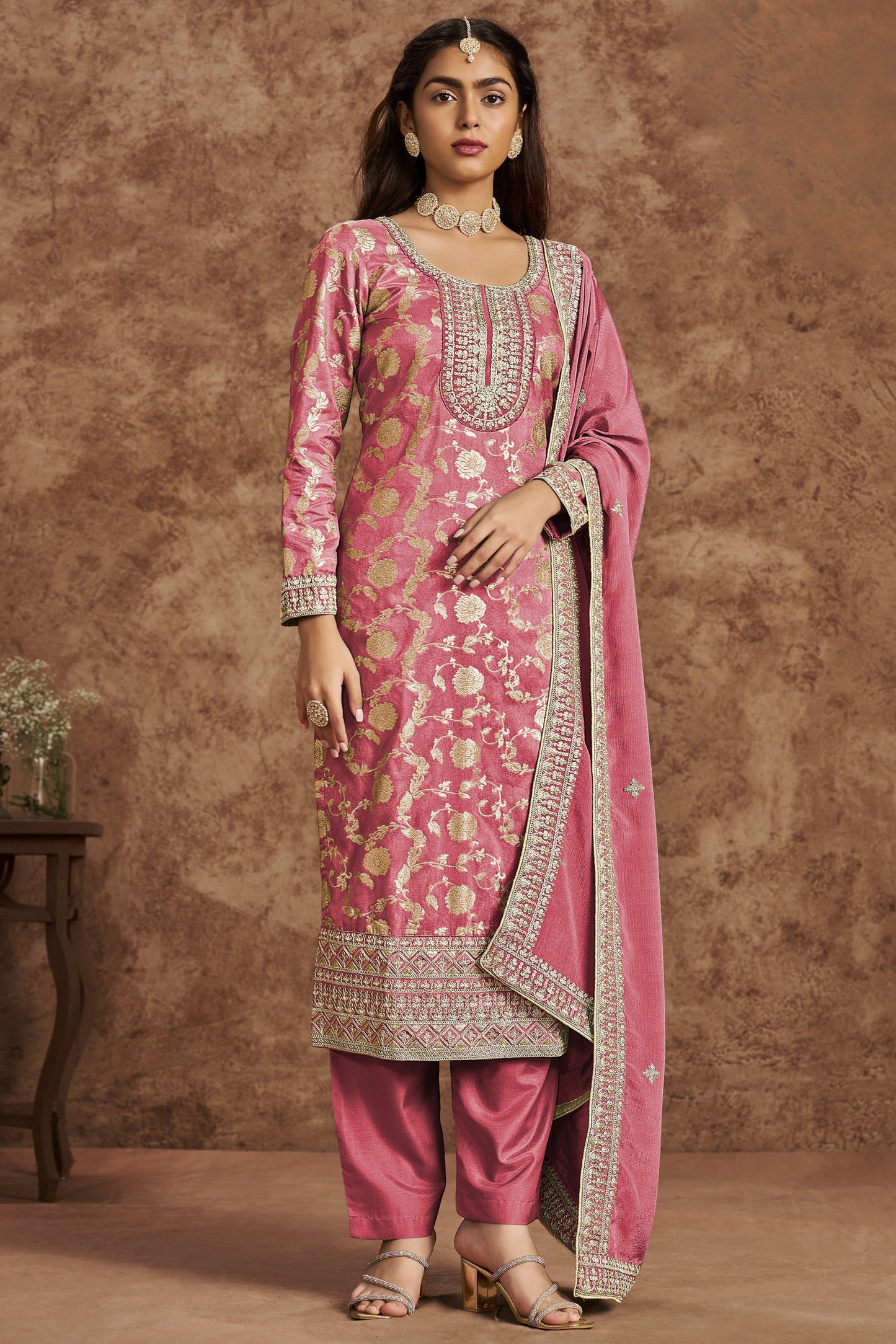 Pink salwar kameez is cheerful and lovely. Perfect for celebrations.
