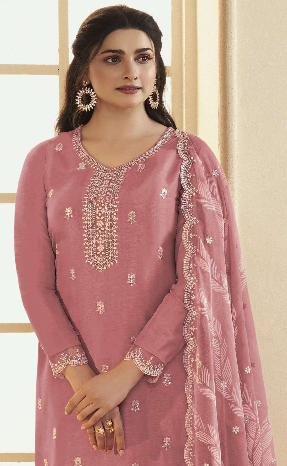 Peach salwar kameez brings soft elegance and warmth, perfect for daytime celebrations and festive charm.