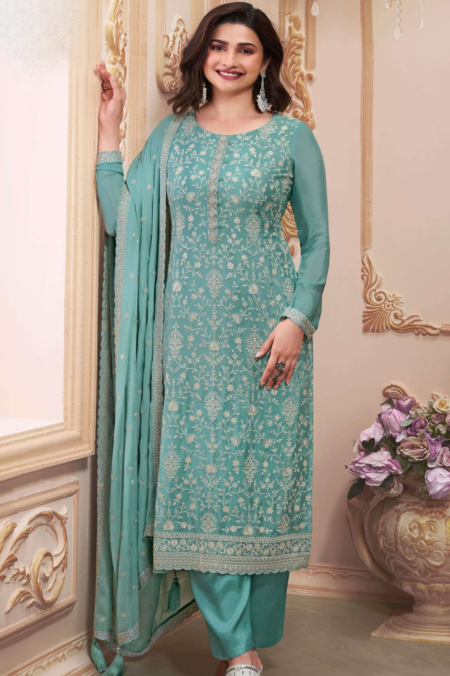 Teal salwar kameez is cool and refreshing. It blends blue and green for a unique look