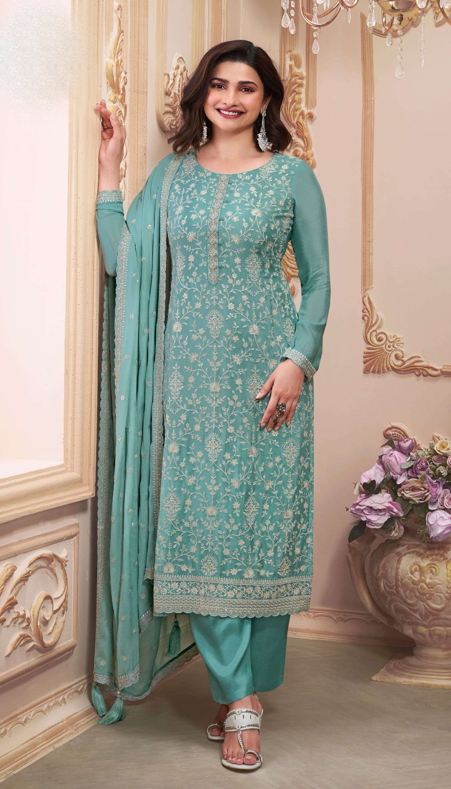 Teal salwar kameez is cool and refreshing. It blends blue and green for a unique look