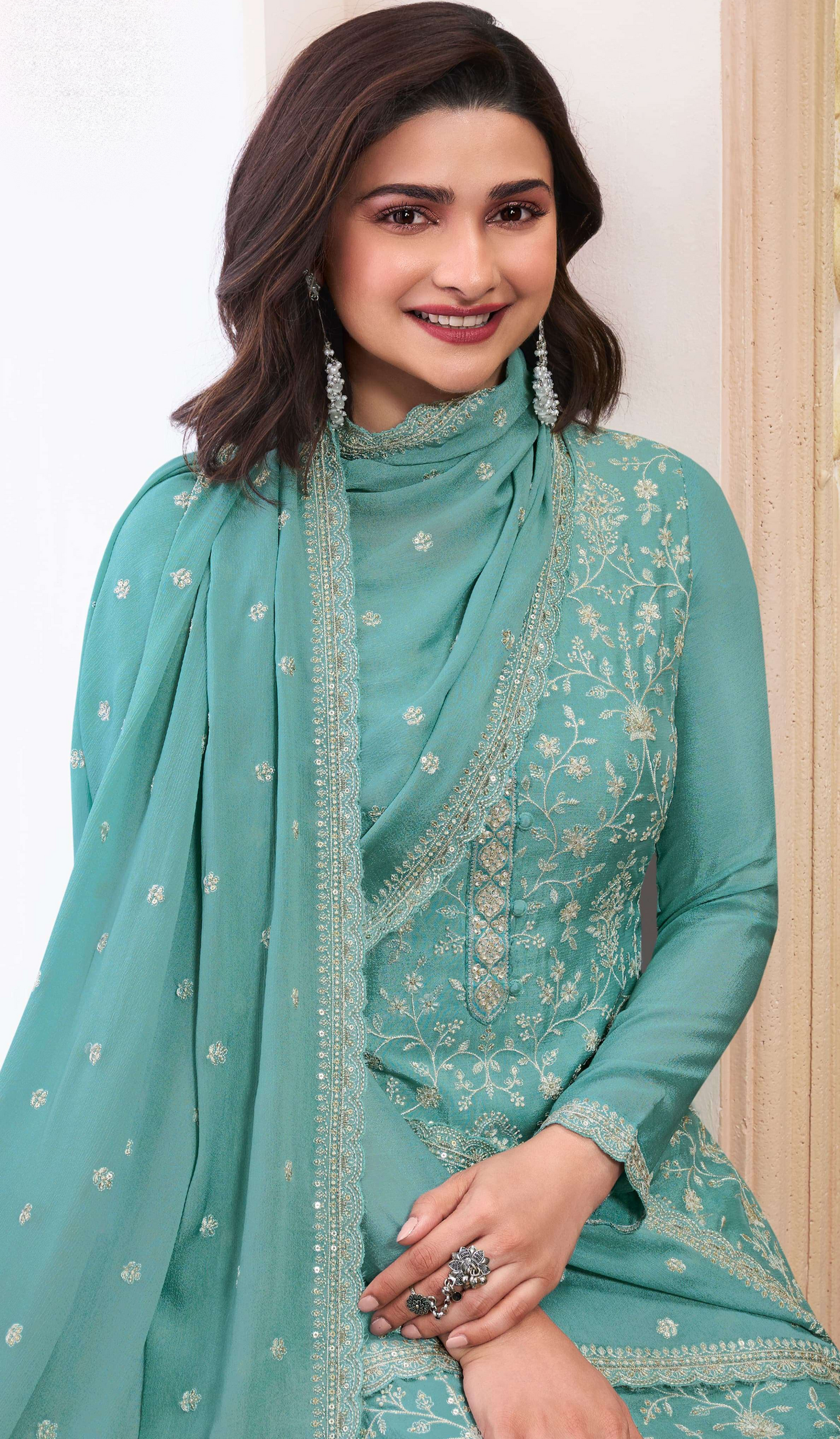 Teal salwar kameez is cool and refreshing. It blends blue and green for a unique look