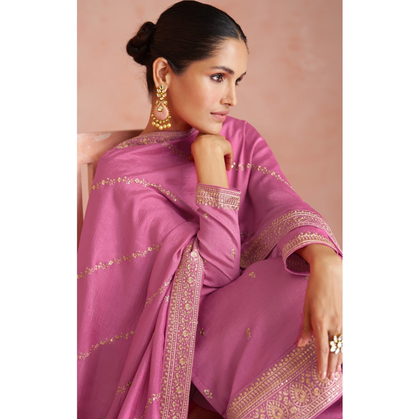 Pink salwar kameez is cheerful and lovely. Perfect for celebrations.