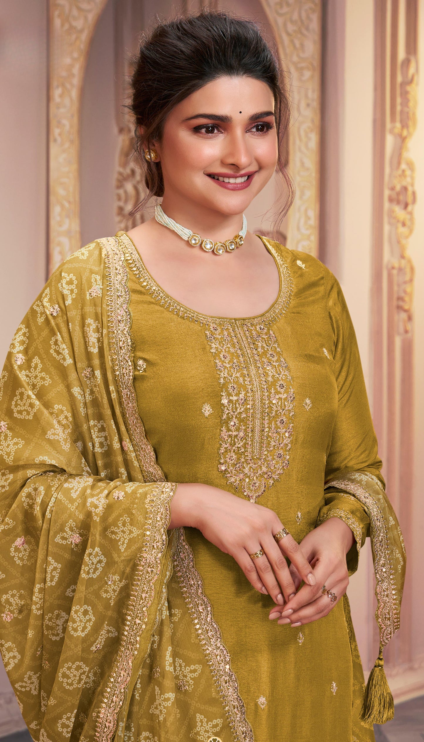 Yellow salwar kameez is bright and happy. Good for haldi or sunny events.