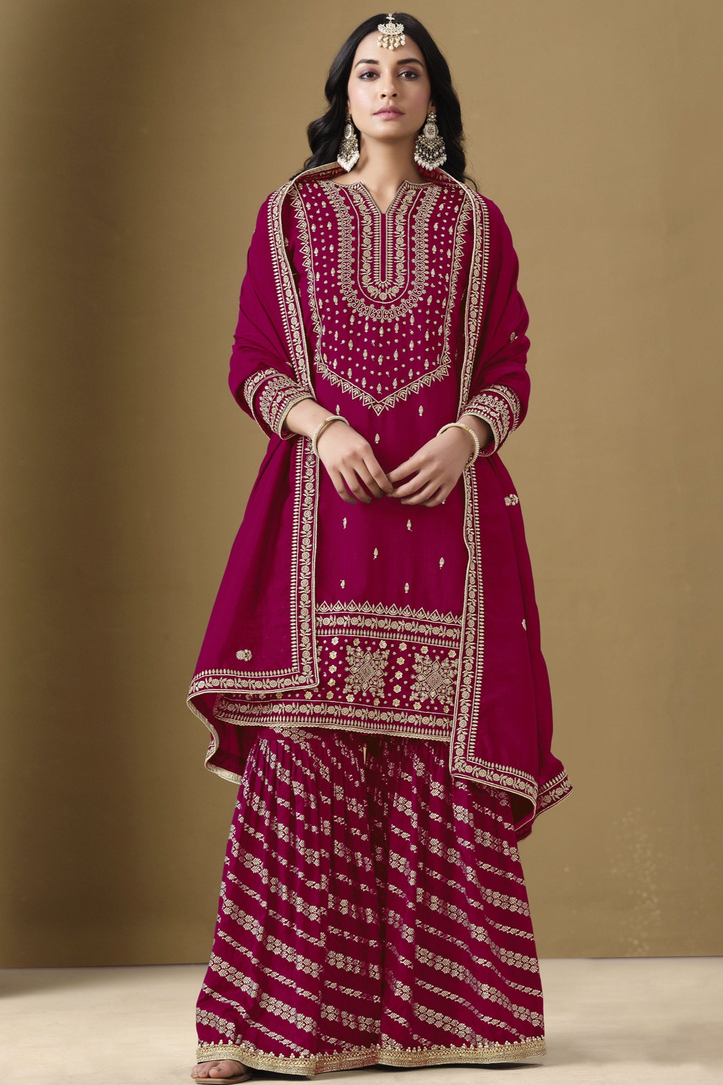 A wine-colored salwar kameez exudes elegance and sophistication