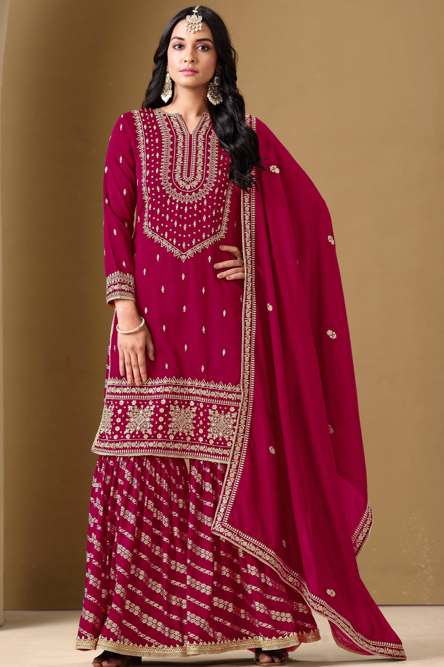 A wine-colored salwar kameez exudes elegance and sophistication