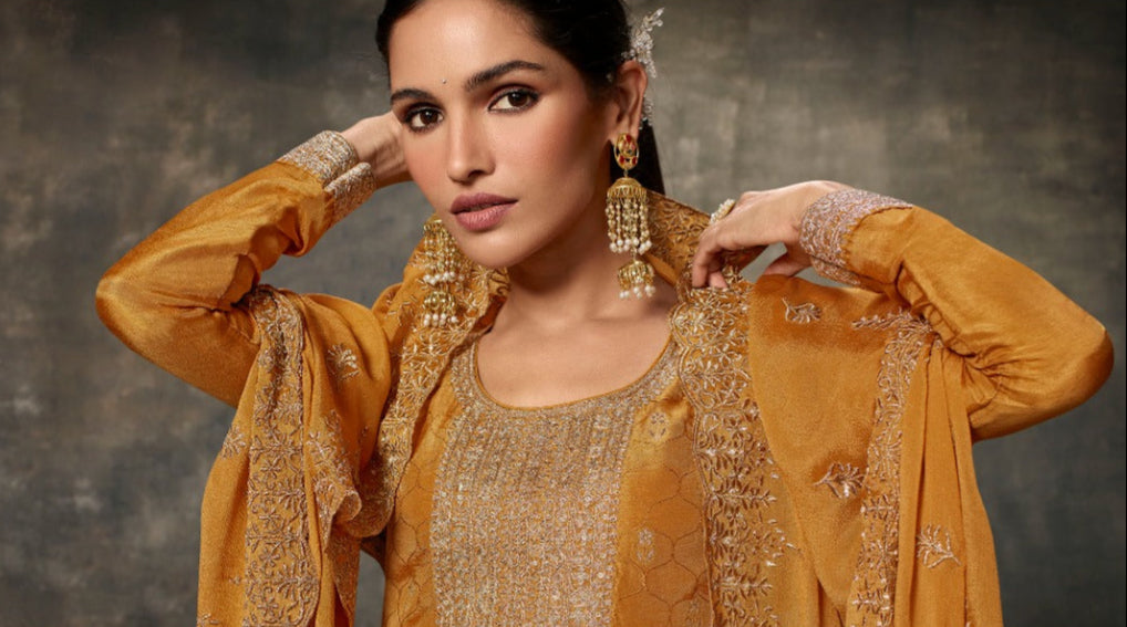 Yellow salwar kameez is bright and happy. Good for haldi or sunny events.