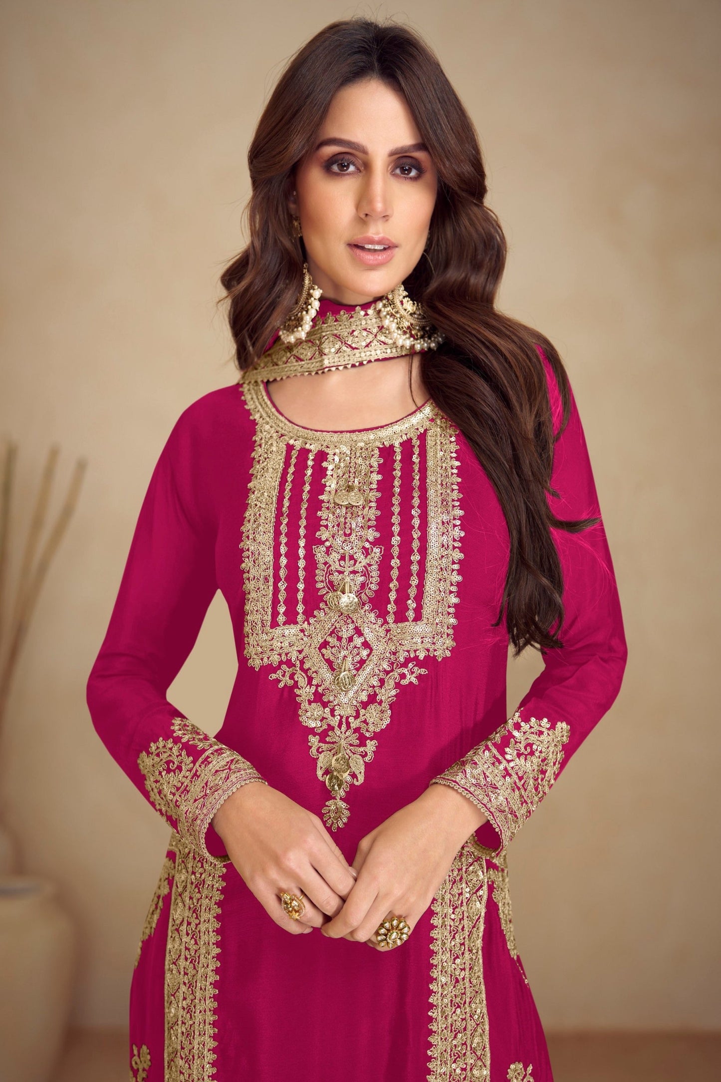 Pink salwar kameez is cheerful and lovely. Perfect for celebrations.