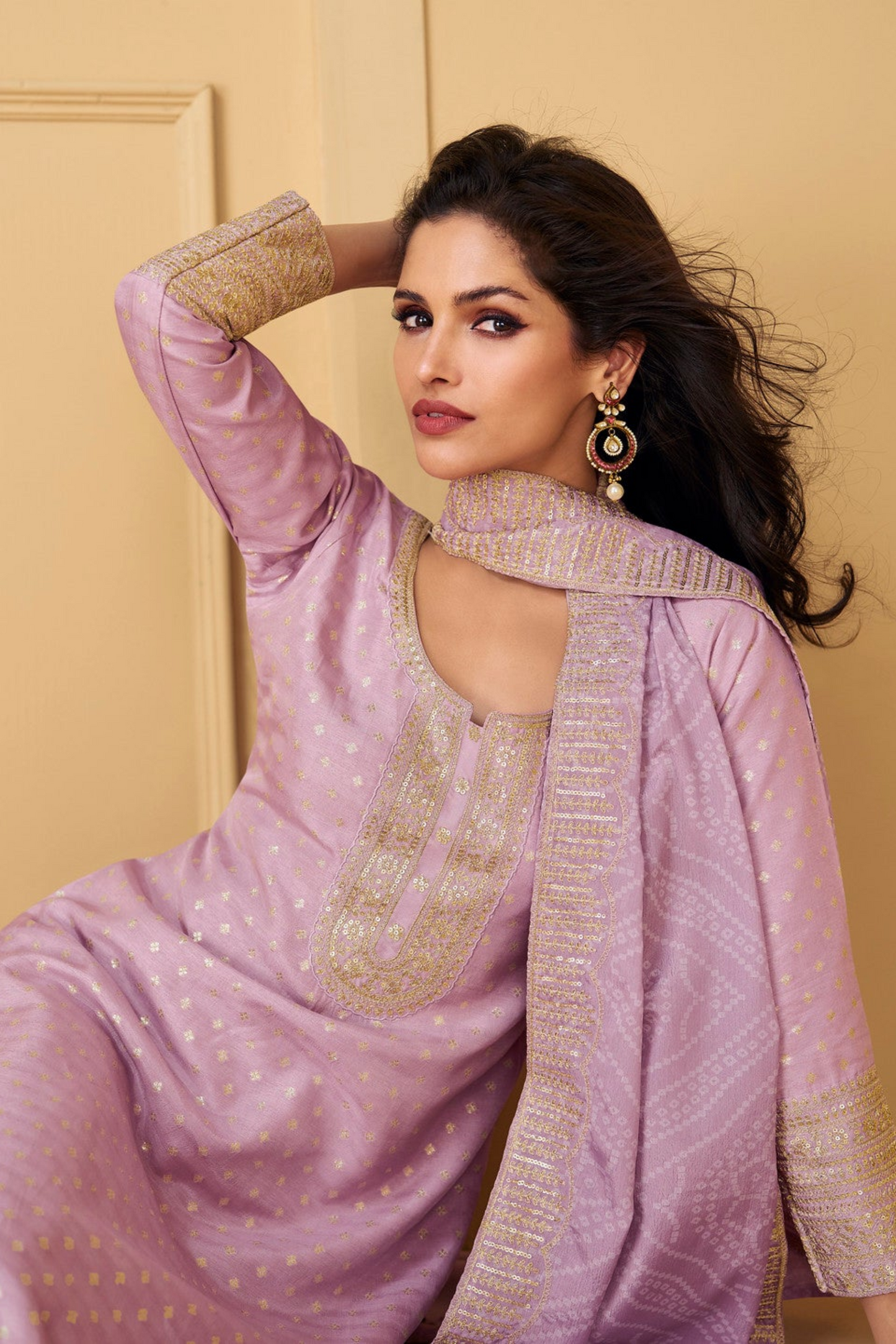 Pink salwar kameez is cheerful and lovely. Perfect for celebrations.