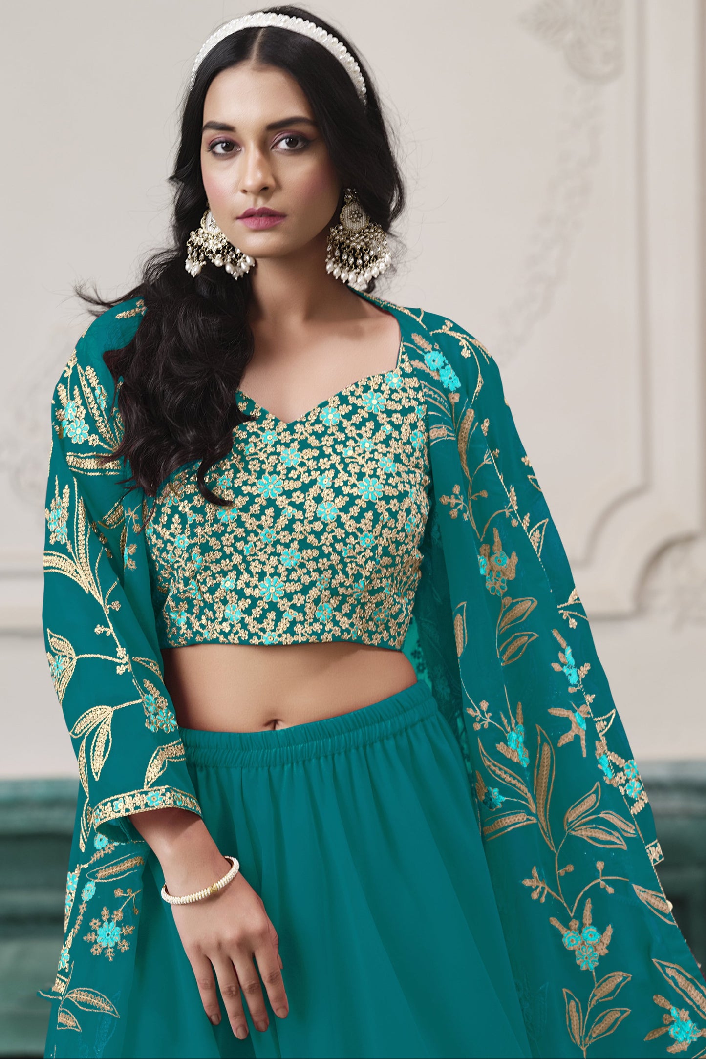 Teal salwar kameez is cool and refreshing. It blends blue and green for a unique look