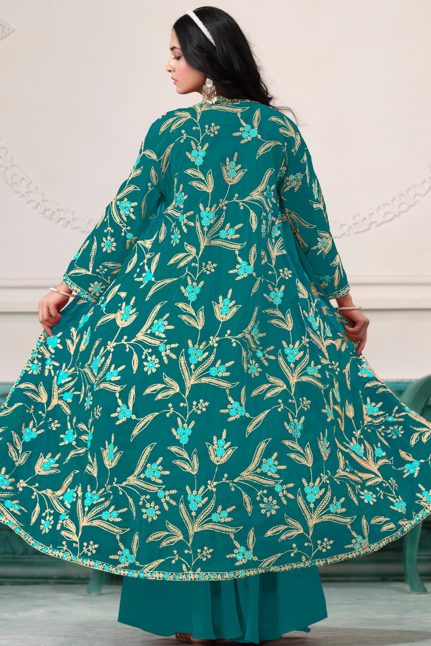 Teal salwar kameez is cool and refreshing. It blends blue and green for a unique look