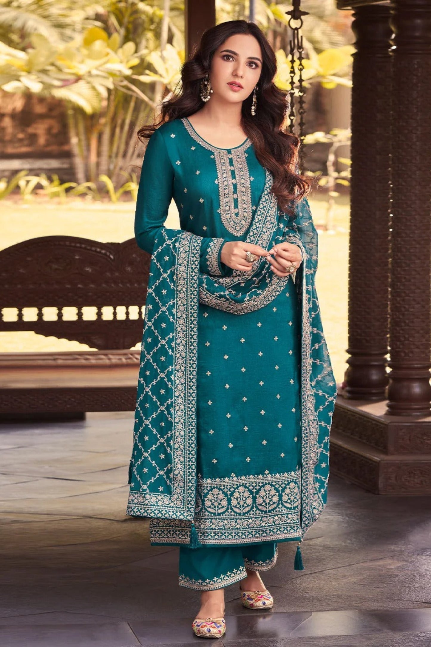 Teal salwar kameez is cool and refreshing. It blends blue and green for a unique look