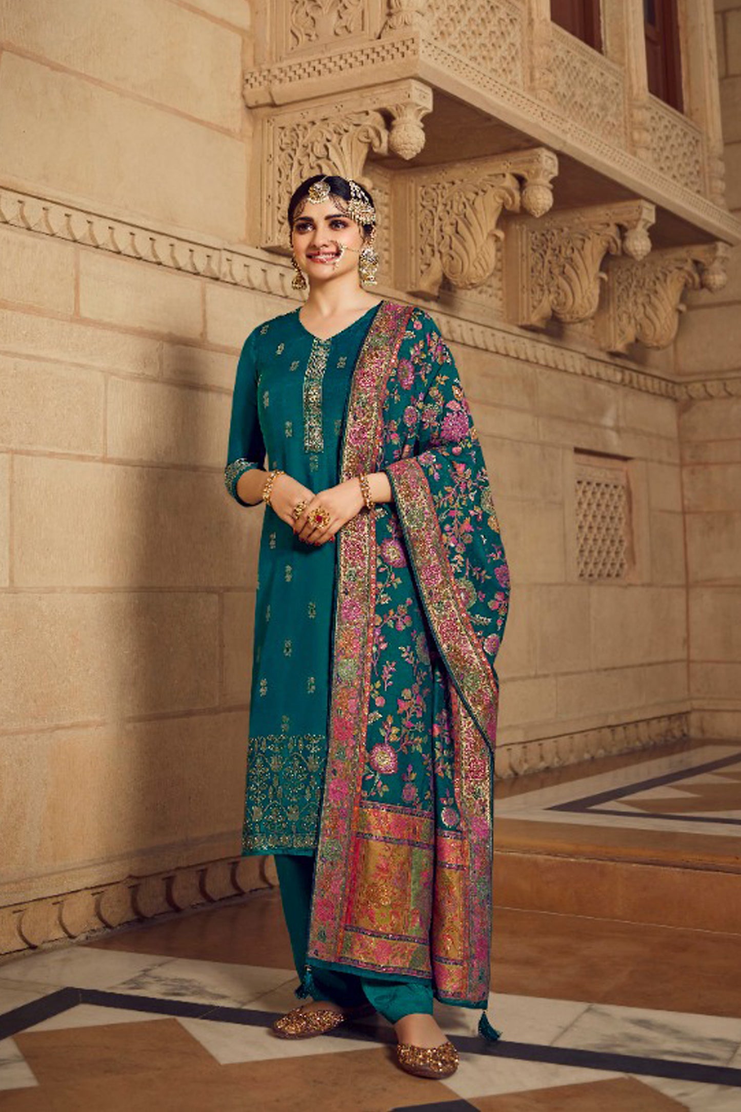 Teal salwar kameez is cool and refreshing. It blends blue and green for a unique look