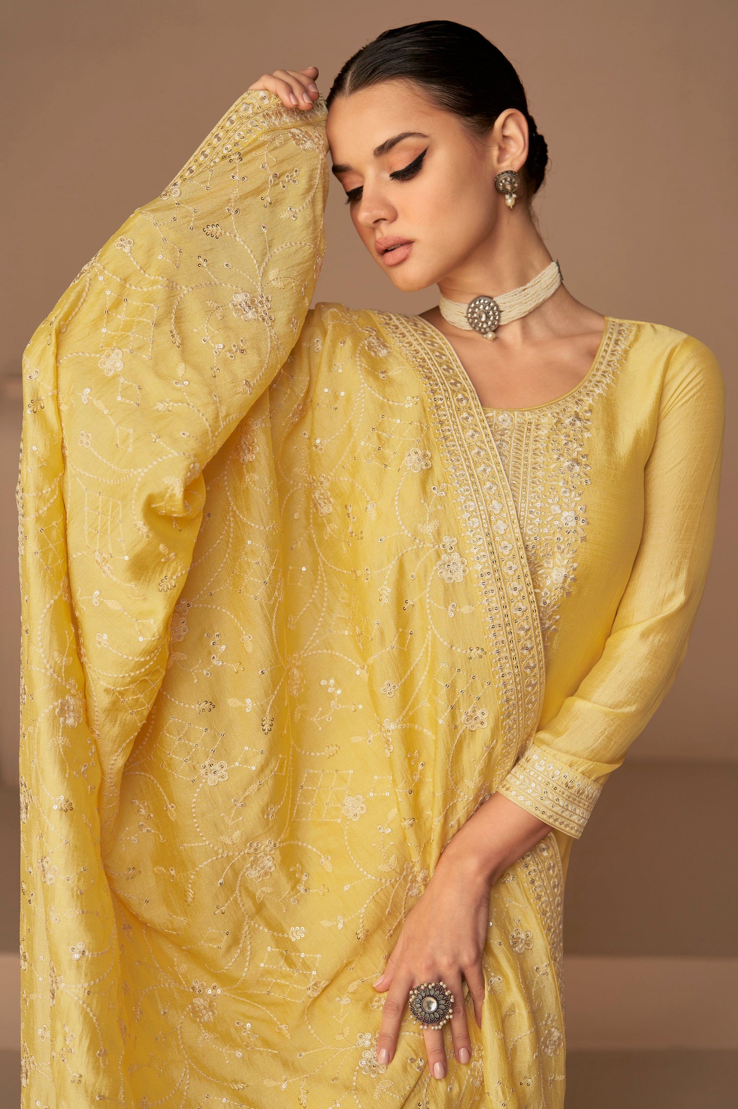 Yellow salwar kameez is bright and happy. Good for haldi or sunny events.
