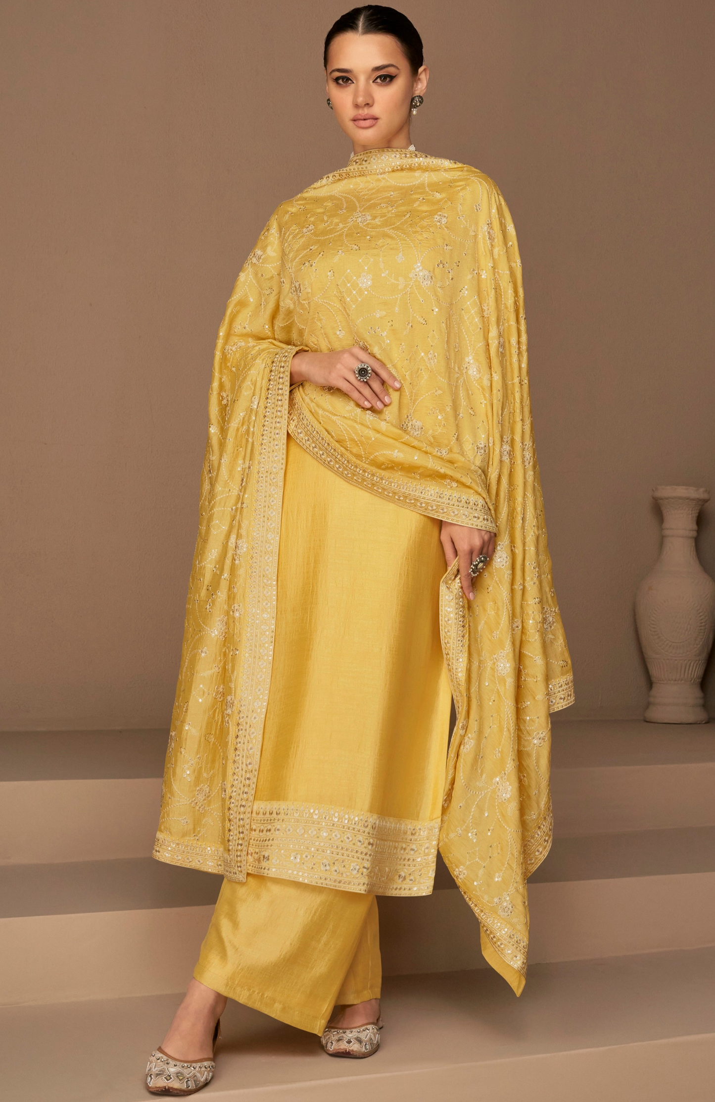 Yellow salwar kameez is bright and happy. Good for haldi or sunny events.