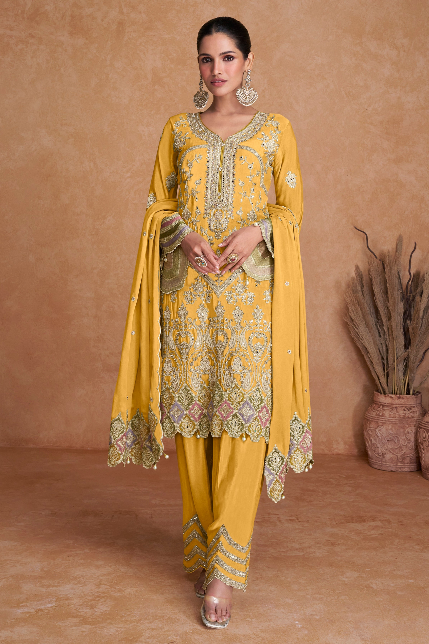 Yellow salwar kameez is bright and happy. Good for haldi or sunny events.